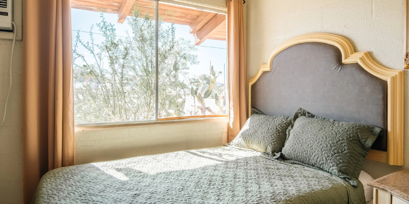 Cozy guest room with desert views at this vacation rental property.<br />
